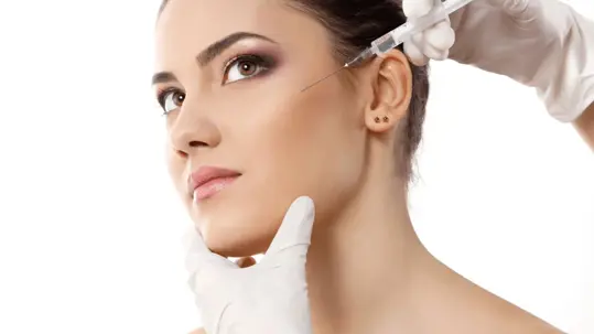 A woman receiving a cosmetic injection