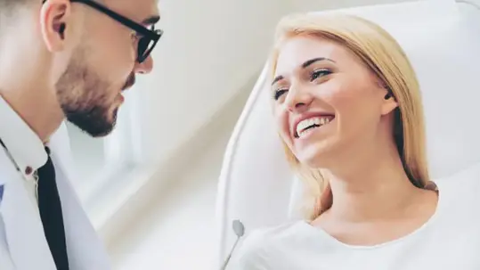 male dentist and female patient