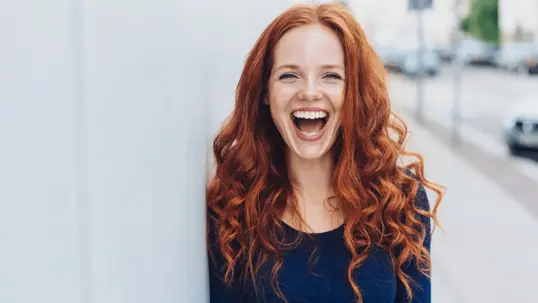 Smiling red-haired woman